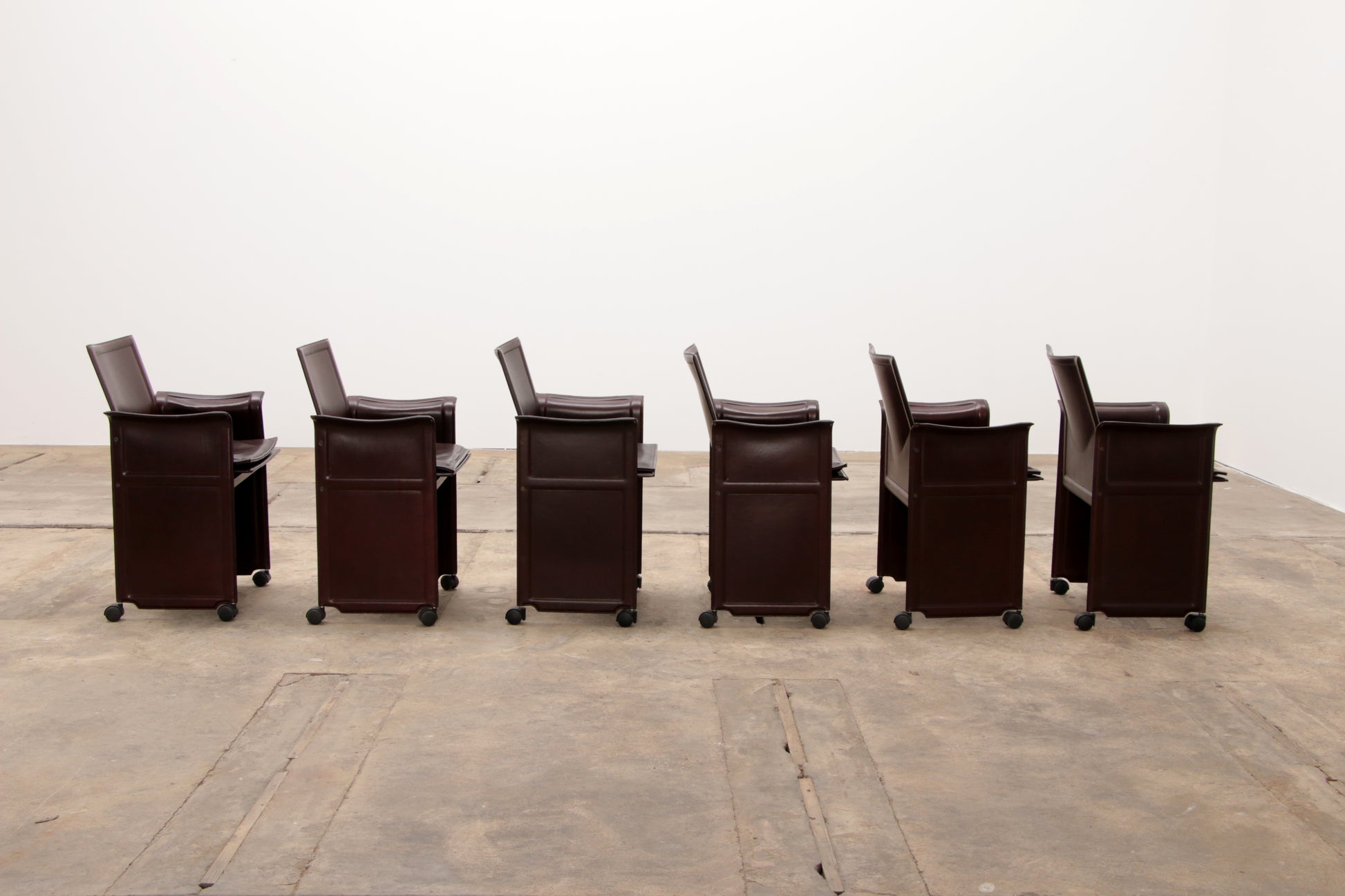 Tito Agnoli voor Matteo Grassi lederen eettafel en zes stoelen