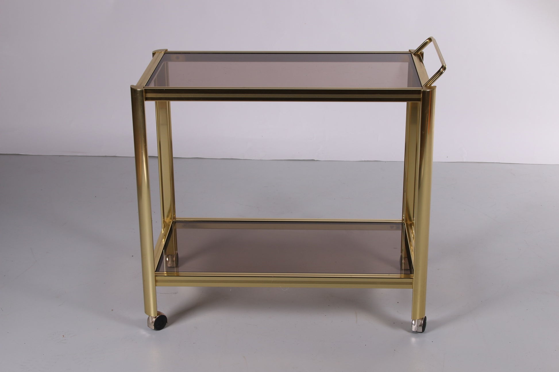 Hollywood Regency trolley met gerookt glas voorkant