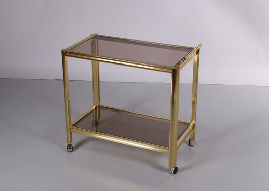 Hollywood Regency trolley met gerookt glas voorkant schuin