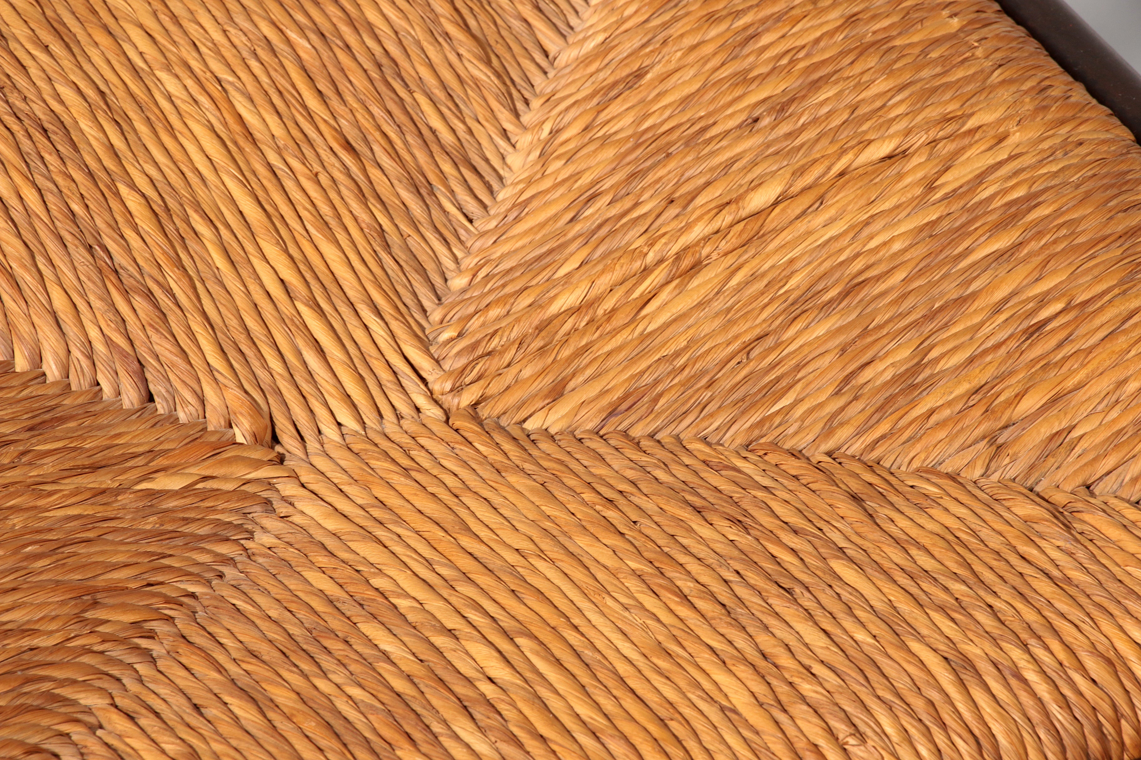 Dining Set inspired by Vico Magistretti, featuring six elegantly re-caned chairs and table.