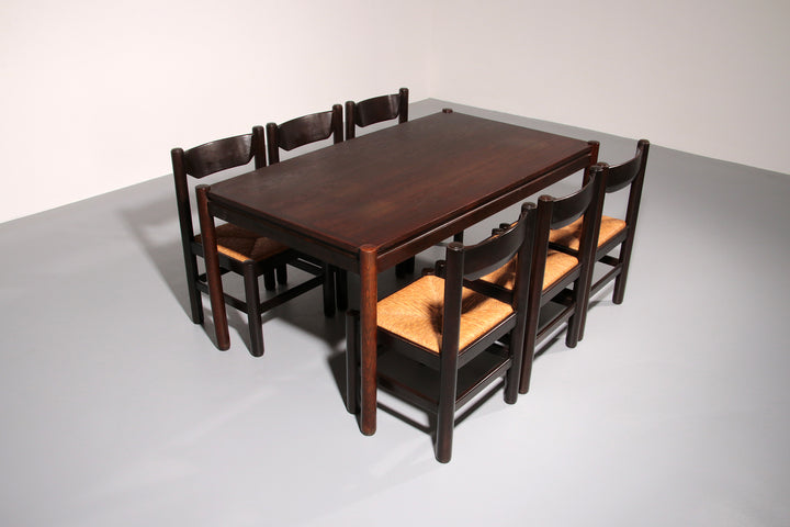 Dining Set inspired by Vico Magistretti, featuring six elegantly re-caned chairs and table.