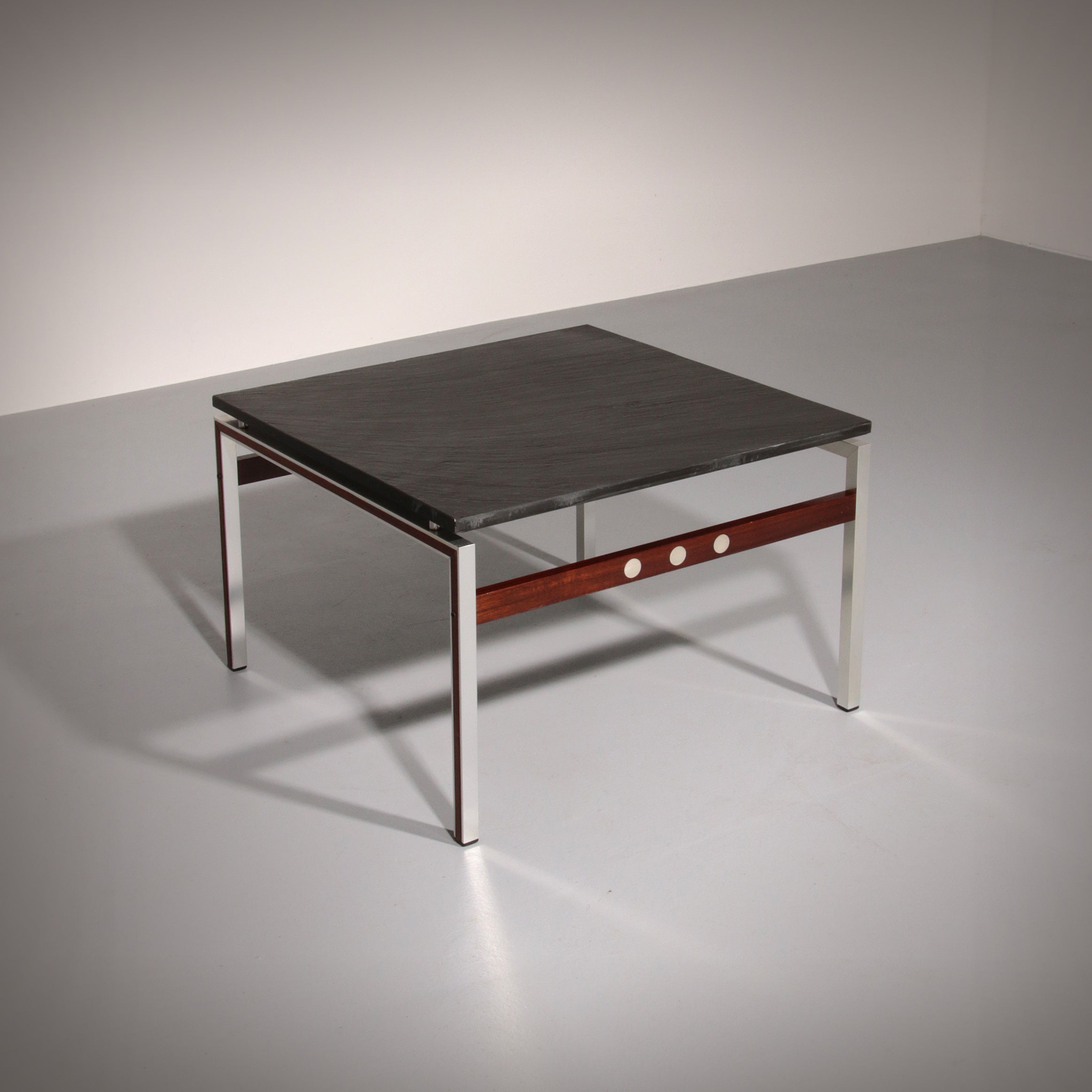 A beautiful and distinctive vintage coffee table, crafted in Denmark in the 1970s. The table combines a natural slate tabletop