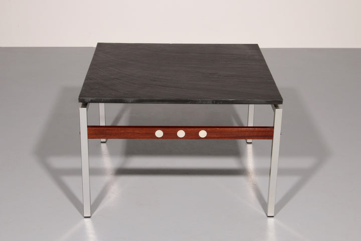 A beautiful and distinctive vintage coffee table, crafted in Denmark in the 1970s. The table combines a natural slate tabletop