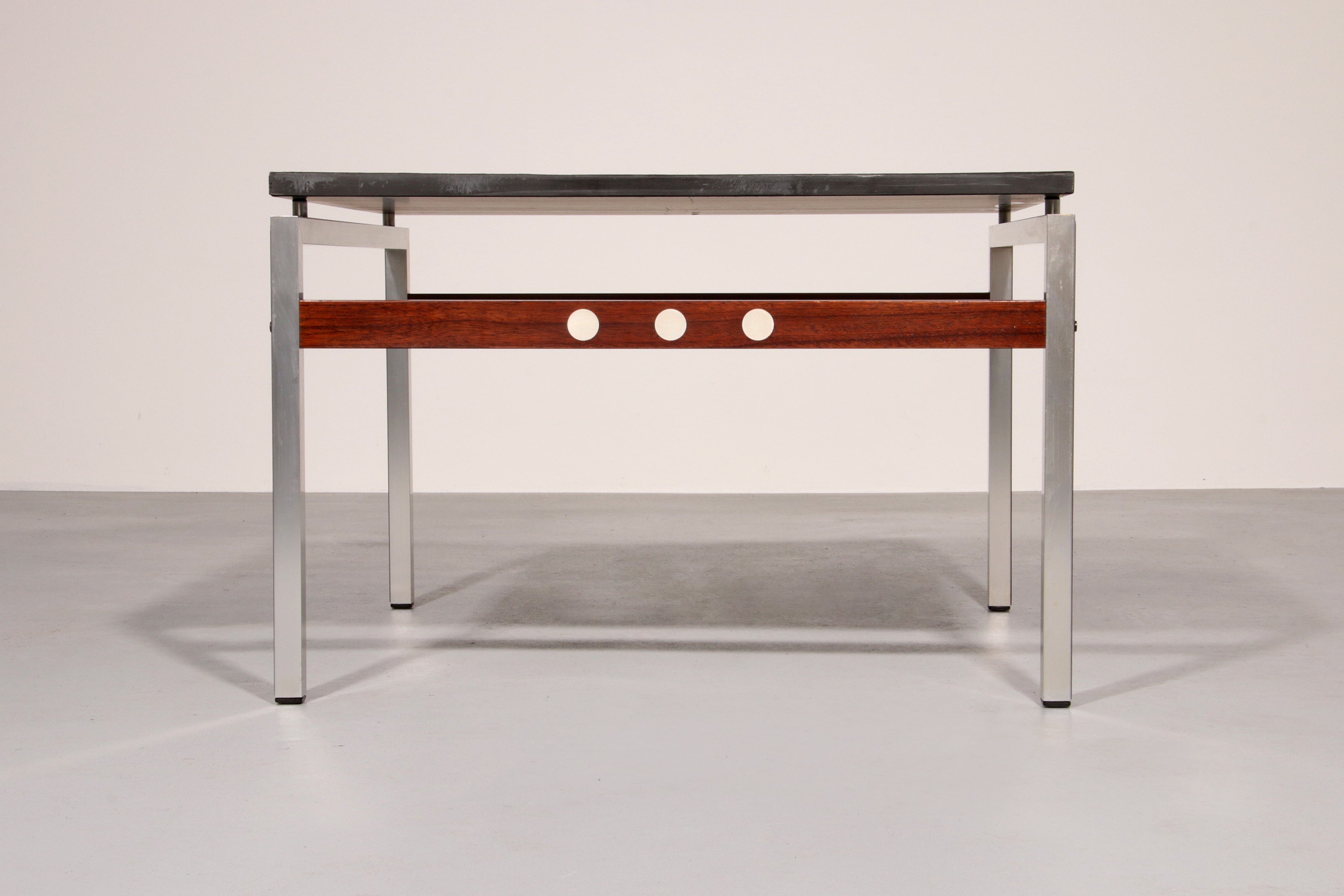 A beautiful and distinctive vintage coffee table, crafted in Denmark in the 1970s. The table combines a natural slate tabletop
