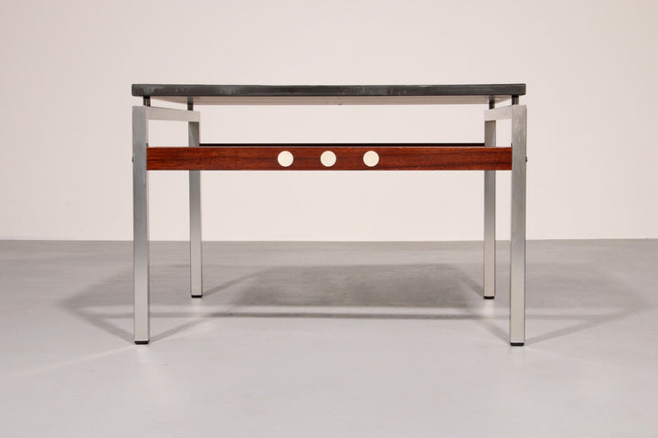 A beautiful and distinctive vintage coffee table, crafted in Denmark in the 1970s. The table combines a natural slate tabletop
