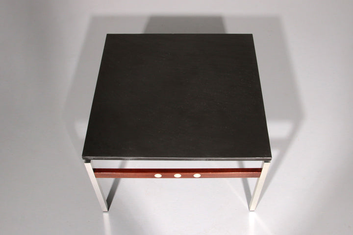 A beautiful and distinctive vintage coffee table, crafted in Denmark in the 1970s. The table combines a natural slate tabletop