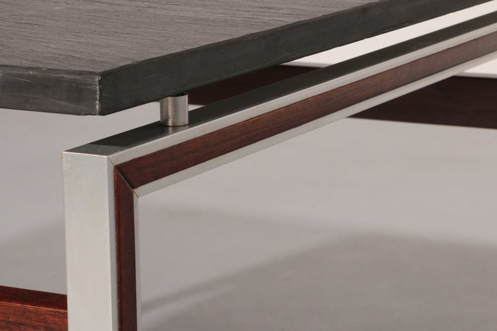 A beautiful and distinctive vintage coffee table, crafted in Denmark in the 1970s. The table combines a natural slate tabletop