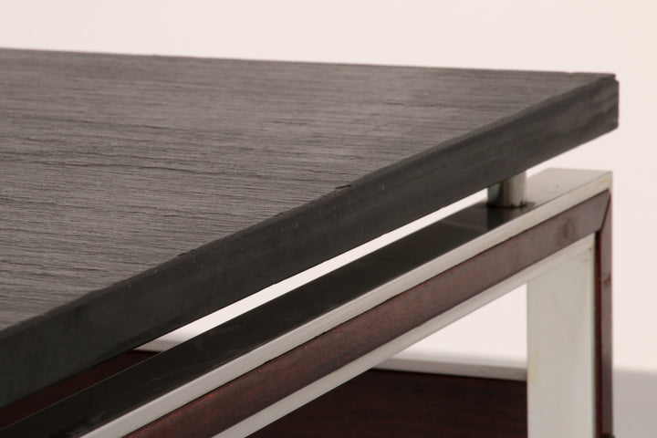 A beautiful and distinctive vintage coffee table, crafted in Denmark in the 1970s. The table combines a natural slate tabletop