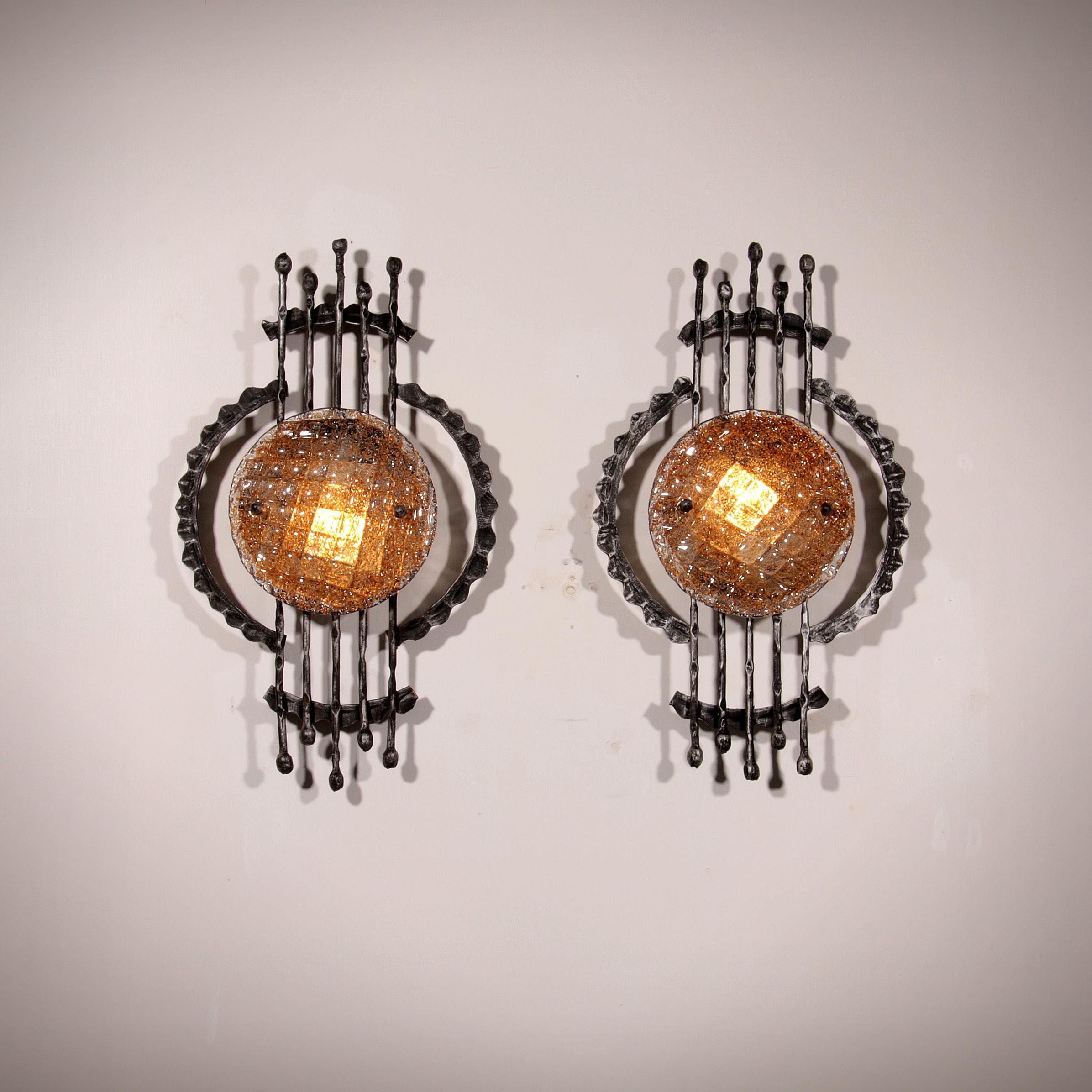 Pair of wrought iron and murano glass wall lights by Tom Ahlström & Hans Ehrich. 1970