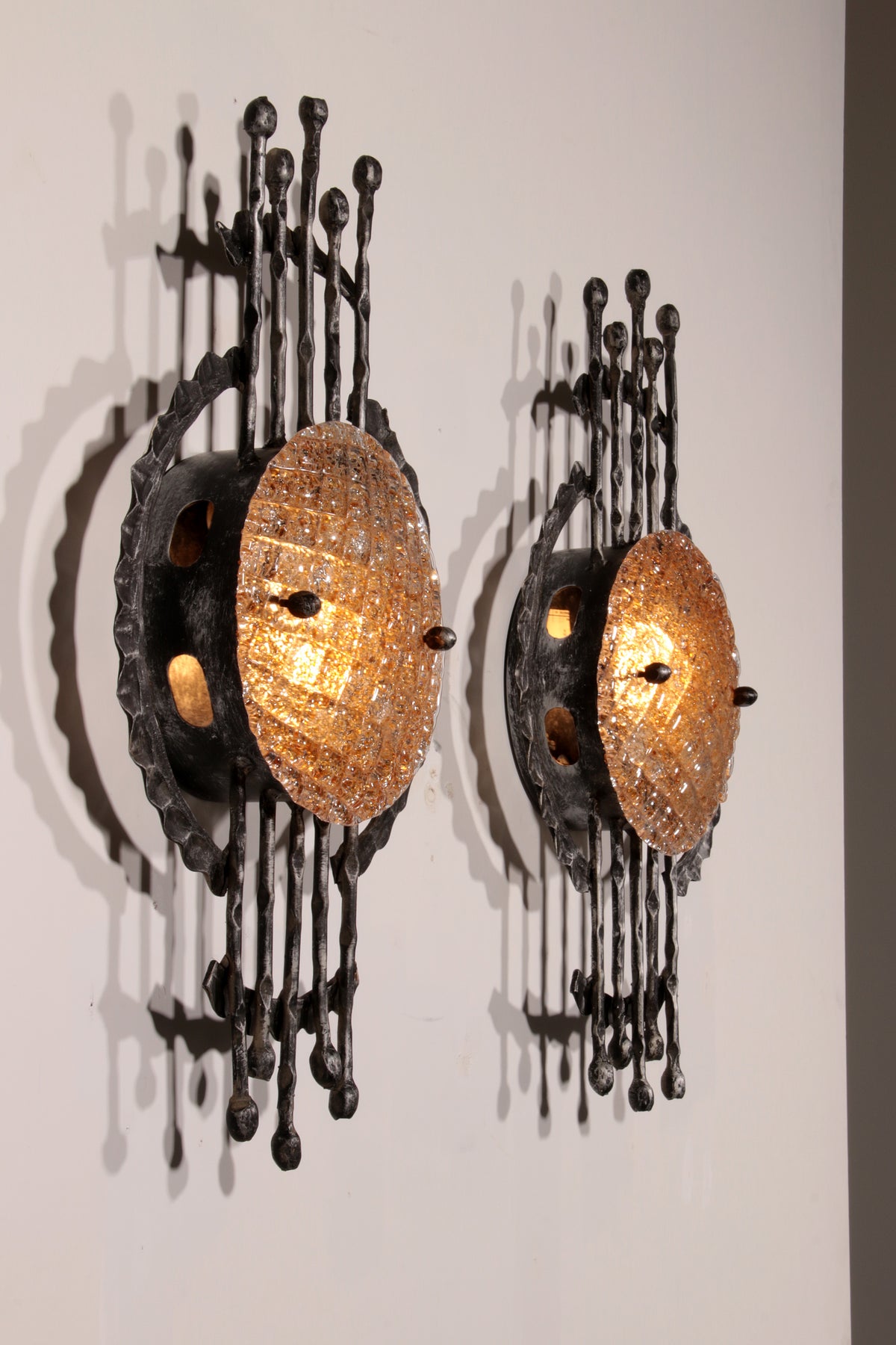 Pair of wrought iron and murano glass wall lights by Tom Ahlström & Hans Ehrich. 1970