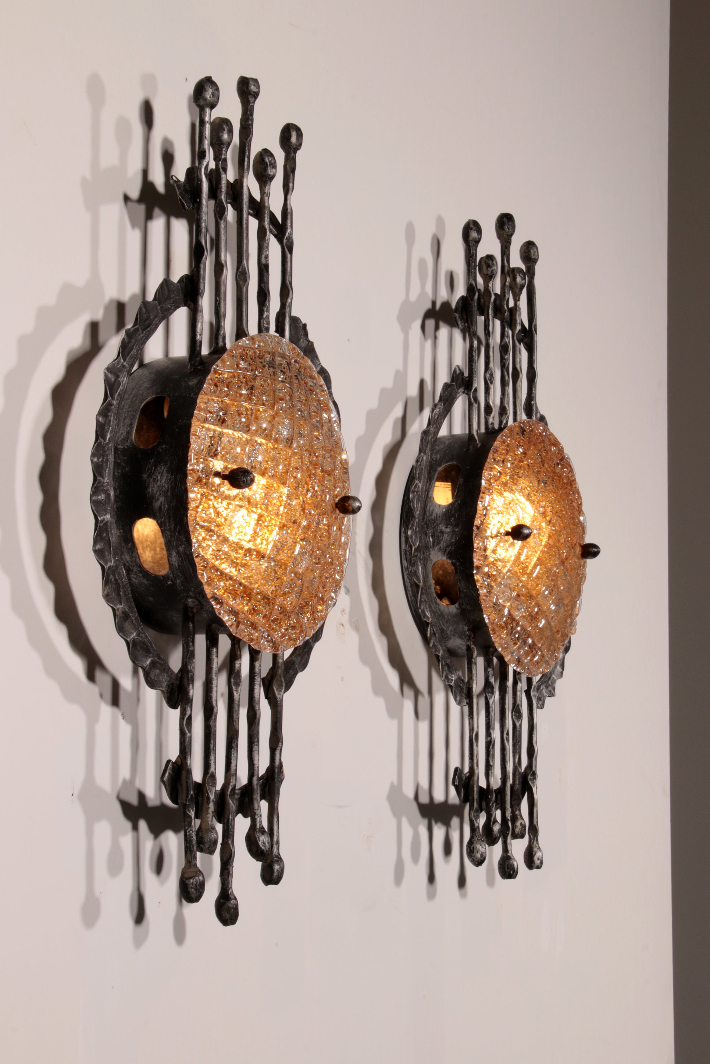 Pair of wrought iron and murano glass wall lights by Tom Ahlström & Hans Ehrich. 1970