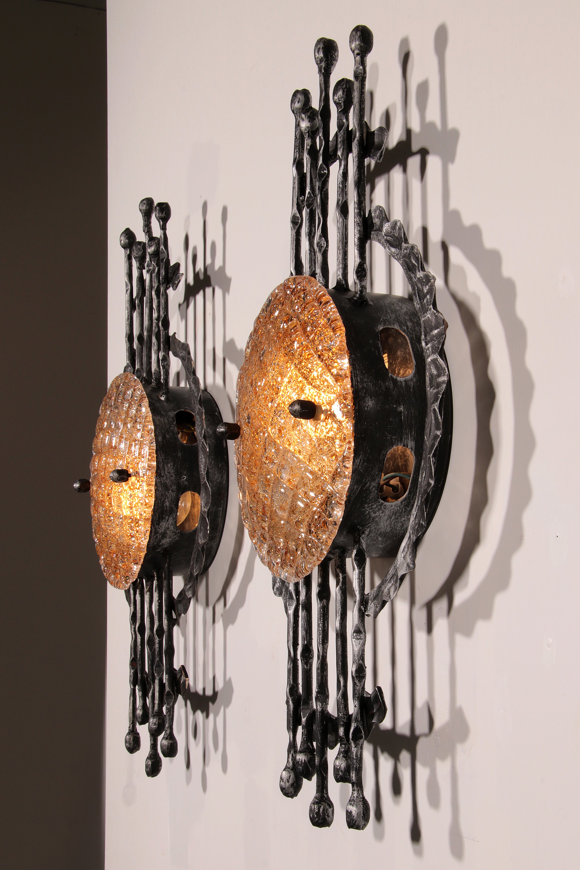Pair of wrought iron and murano glass wall lights by Tom Ahlström & Hans Ehrich. 1970