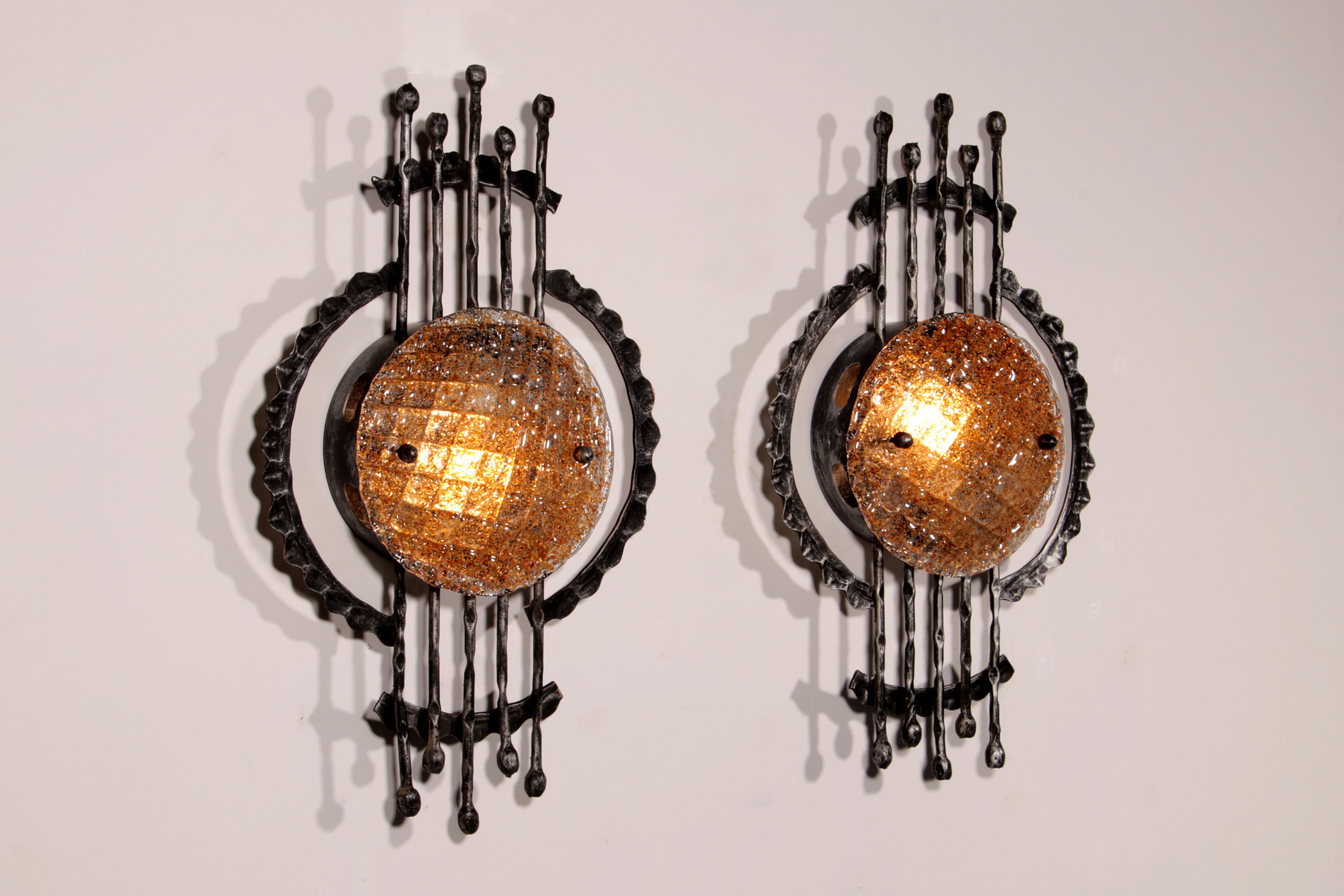 Pair of wrought iron and murano glass wall lights by Tom Ahlström & Hans Ehrich. 1970