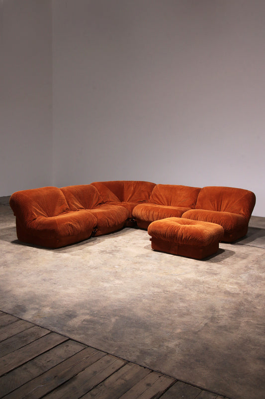 Airborne sectional sofa with ottoman 'Patate' in orange Corduroy wide rib fabric.