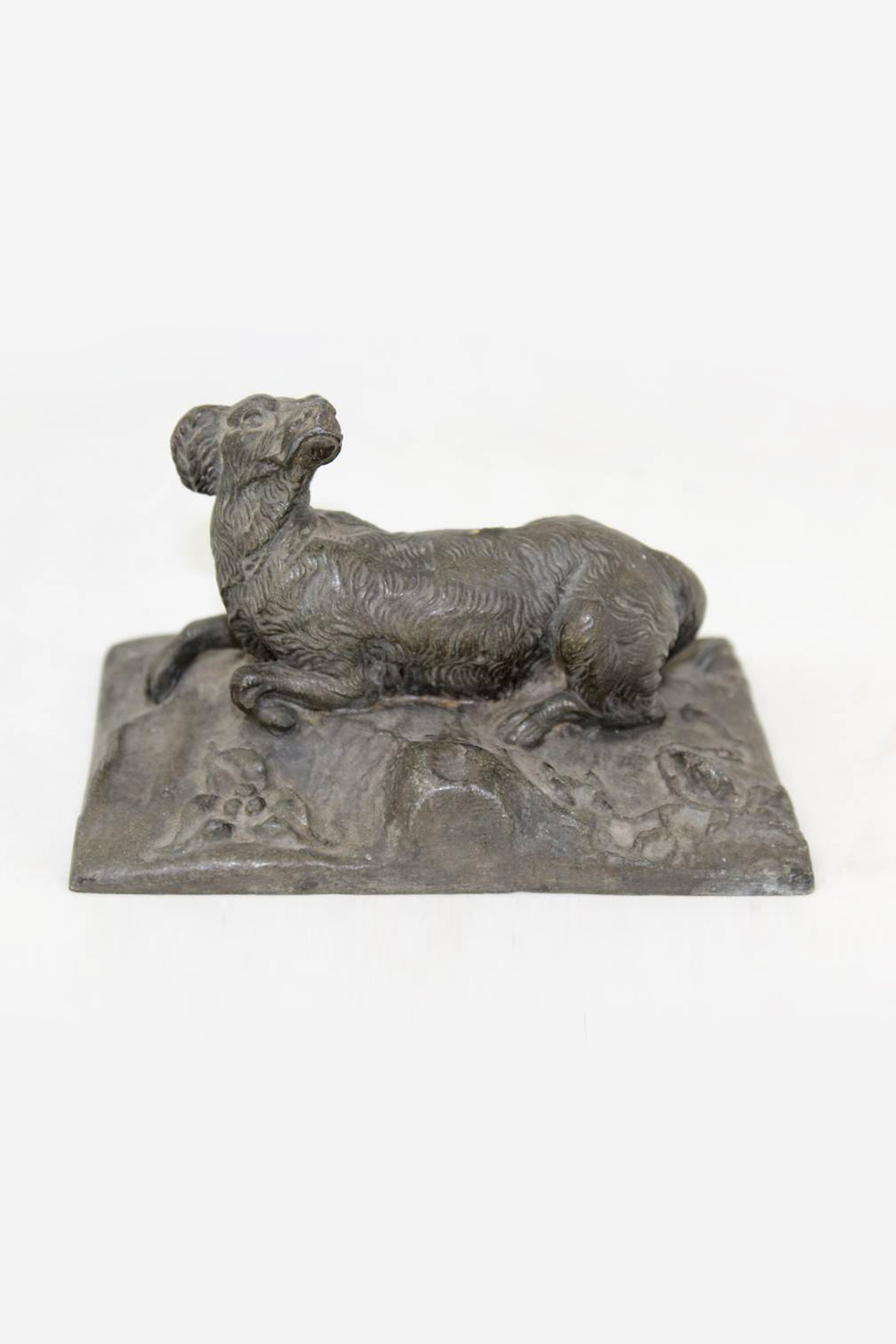 Beautiful Bronze hunting dog in the field made in the 1960s