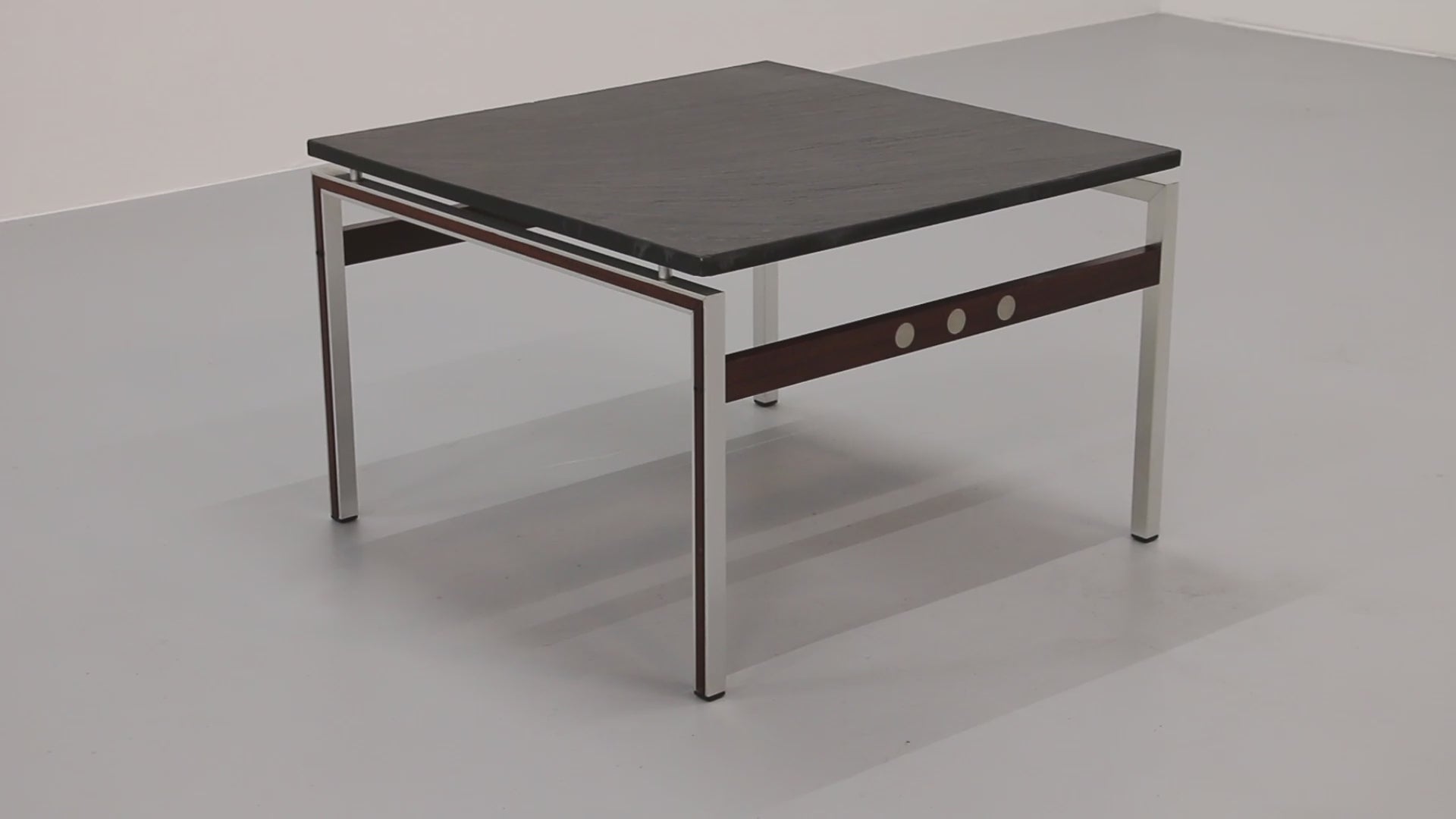 A beautiful and distinctive vintage coffee table, crafted in Denmark in the 1970s. The table combines a natural slate tabletop