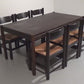 Dining Set inspired by Vico Magistretti, featuring six elegantly re-caned chairs and table.