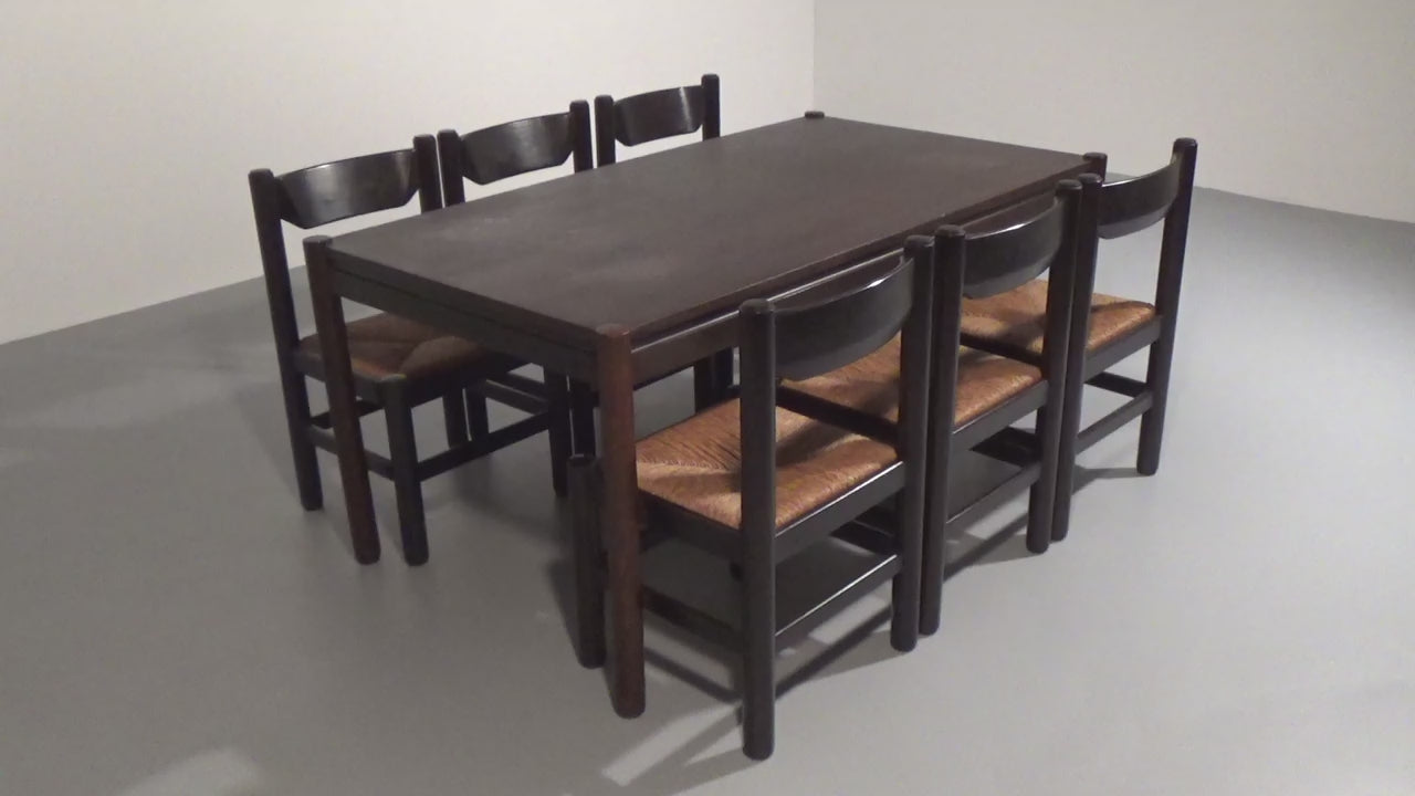 Dining Set inspired by Vico Magistretti, featuring six elegantly re-caned chairs and table.
