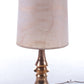 Large golden ceramic table lamp hand turned with original shade from the 70s.