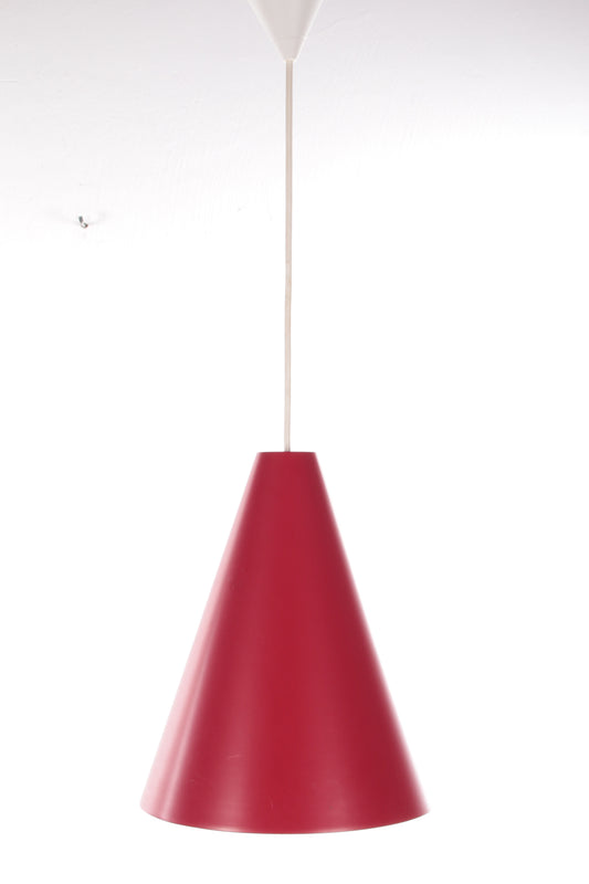 Red tip pendant lamp with glass in it made in the 1960s.