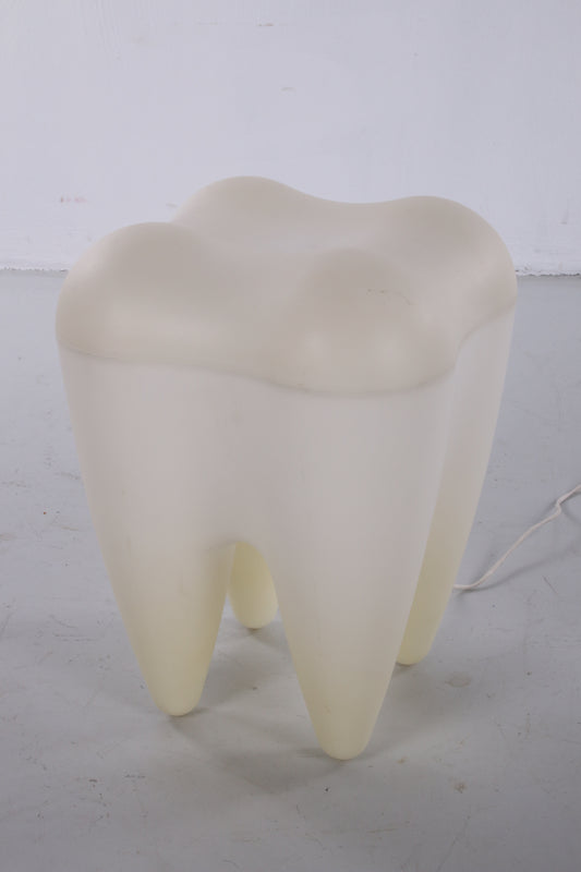 Plastic stool in the shape of a molar