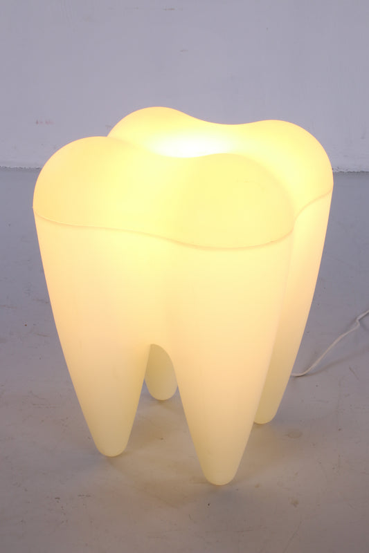 Plastic stool in the shape of a molar