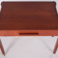 Danish teak side table with wheels and drawers