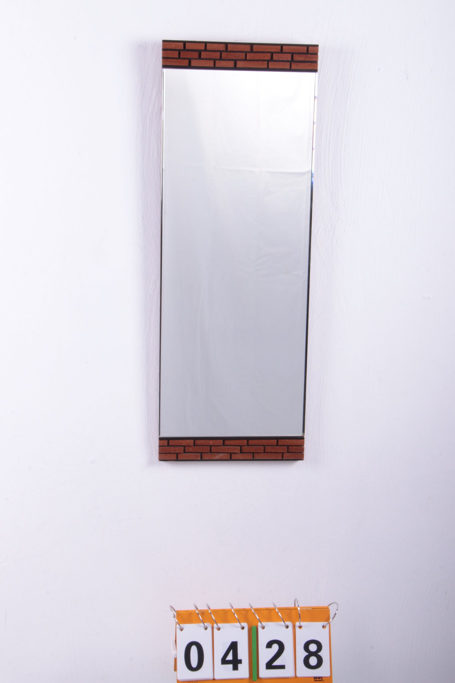 Oblong wall mirror with block pattern