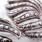 Silver brooches with rhinestones