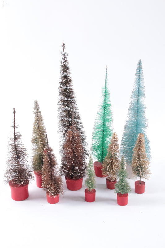 Lot of antique christmas trees in different sizes light and dark green.
