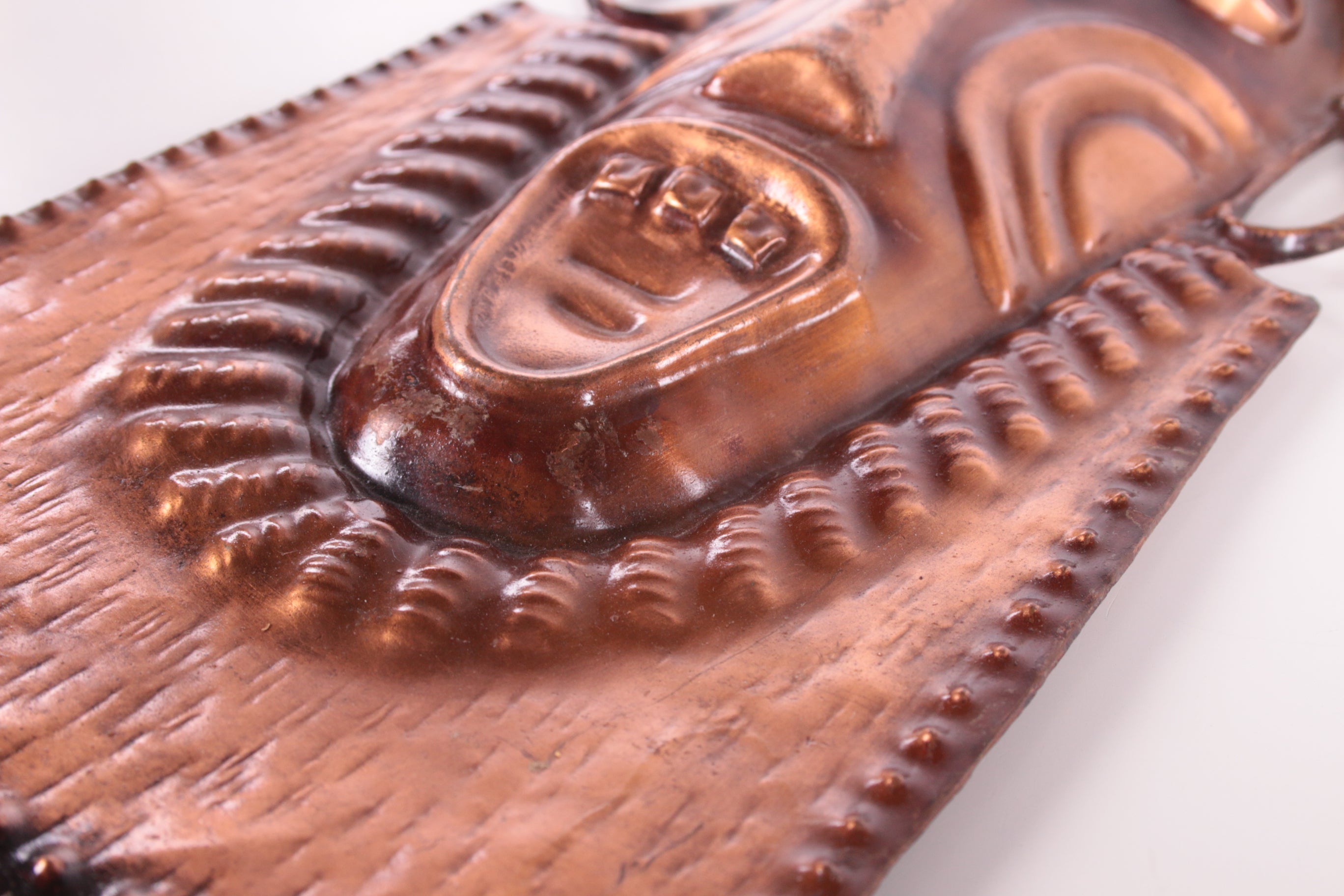 Set Vintage koperen maskers detail onderkant