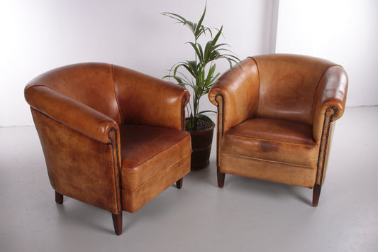 Set of 2 Sheepskin leather club chair with beautiful patina.
