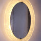 Ovale Badkamer wandspiegel met verlichting en plexiglas rand van Hillebrand voorkant licht aan