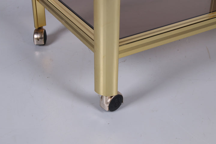 Hollywood Regency trolley met gerookt glas detail poot met wieltje