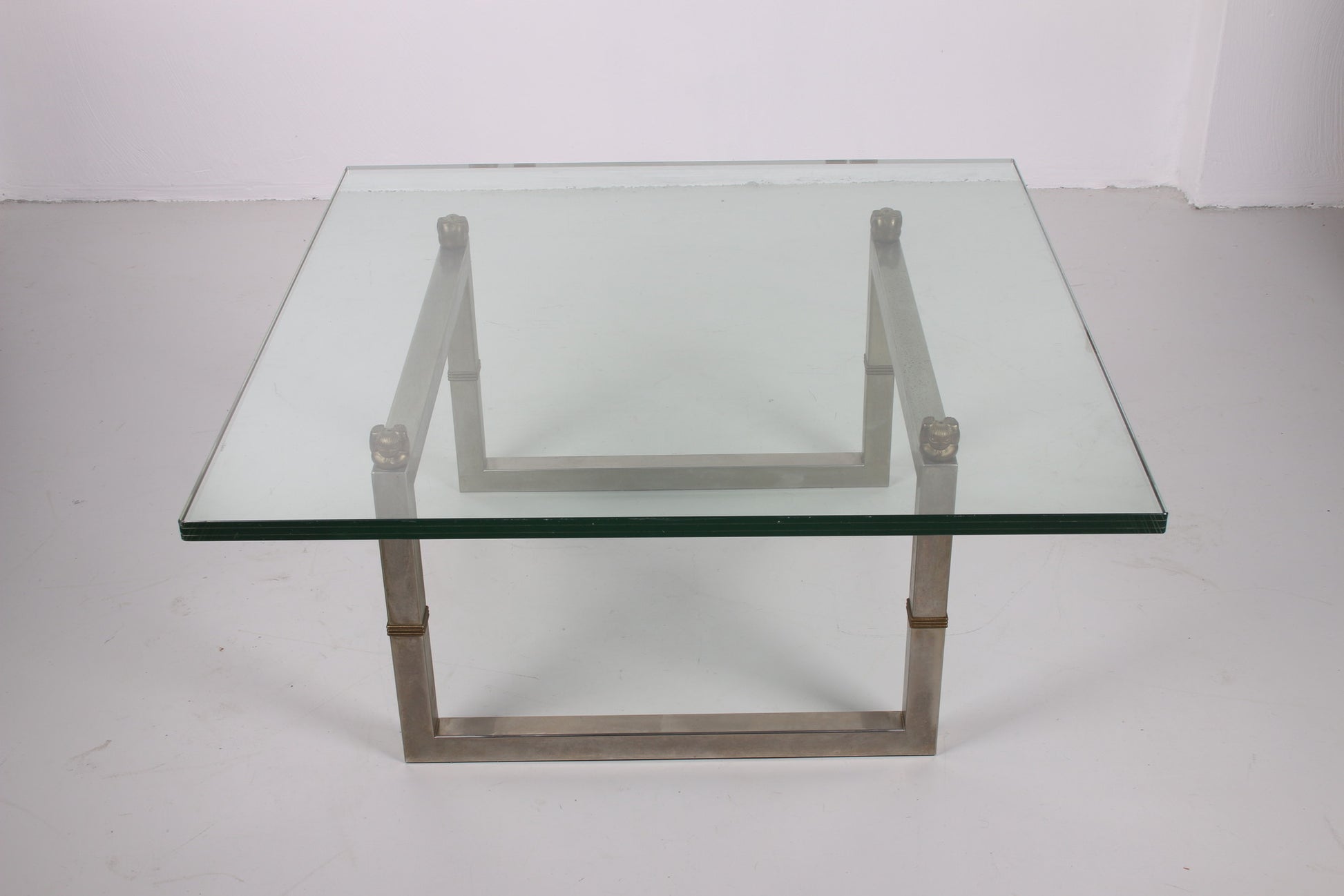 Peter Ghyczy glazen salontafel met roestvrij stalen frame Biri T29 voorkant