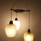 Scandinavische Hanglamp met 3 gekleurden Glazen bollen voorkant licht aan